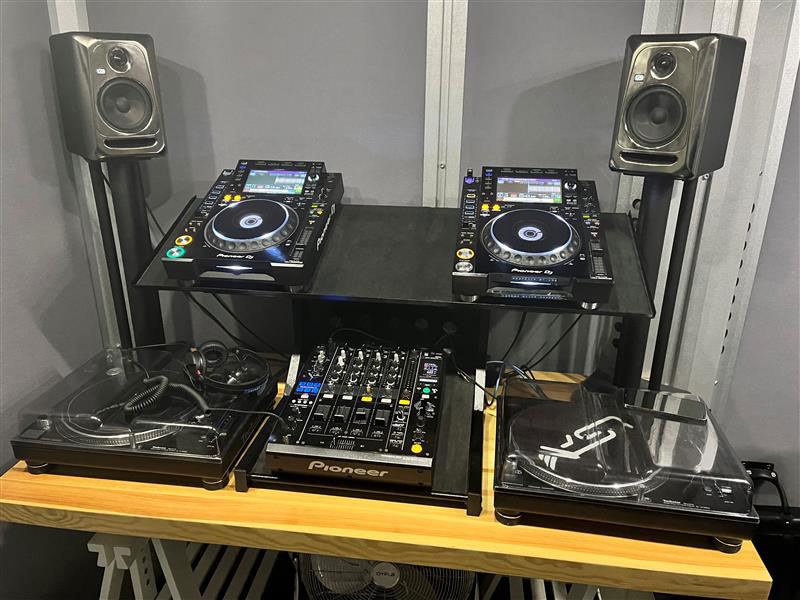 DJ console with mixer knobs and CD turntables